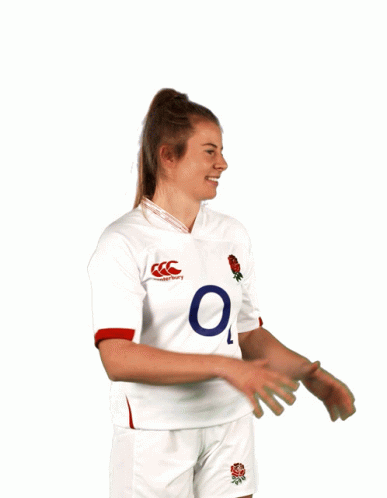 A Man Wearing A White O2 Jersey Holds A Rugby Ball In Front Of His Face GIF