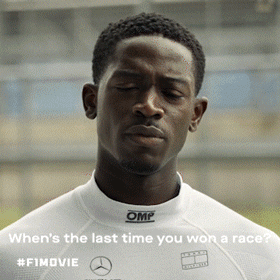 A Man Wearing A White Omp Shirt Is Looking Down GIF