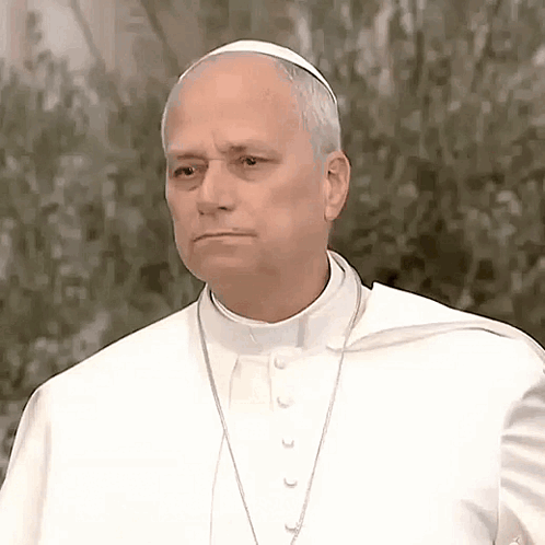 A Man Wearing A White Robe And A White Hat Looks Serious GIF