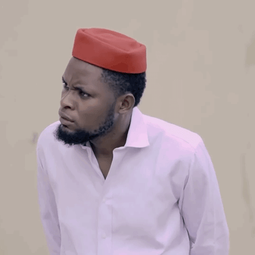 A Man Wearing A White Shirt And A Red Hat Is Asking How Much GIF