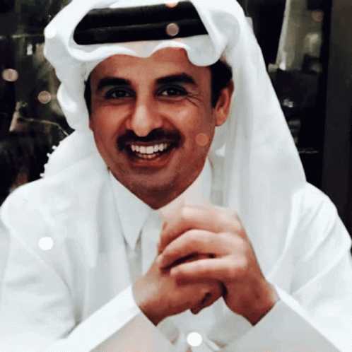 A Man Wearing A White Shirt And Tie Is Smiling GIF