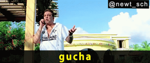 A Man Wearing A White Shirt That Says Champions On It Is Talking On A Cell Phone GIF