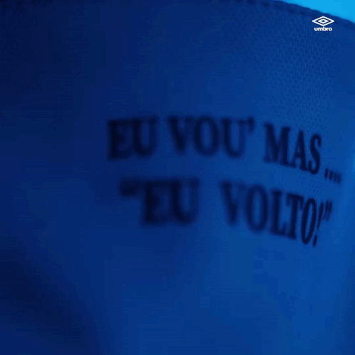 A Man Wearing A White Shirt That Says " Eu Vou " On The Collar GIF