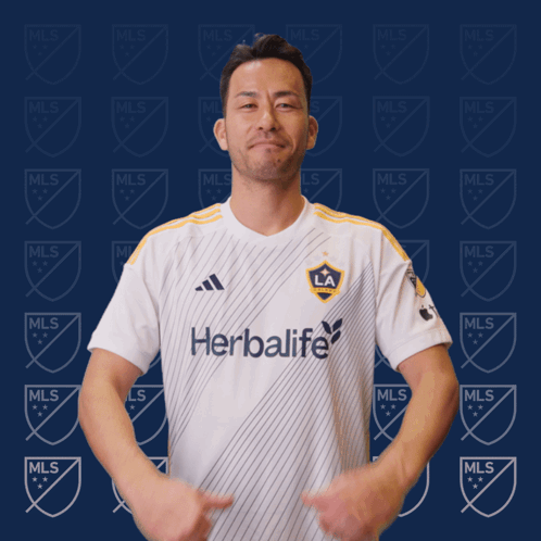 A Man Wearing A White Shirt That Says Herbalife GIF