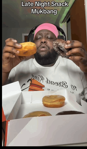 A Man Wearing A White Shirt That Says ' Late Night Snack Mukbang ' On The Front GIF