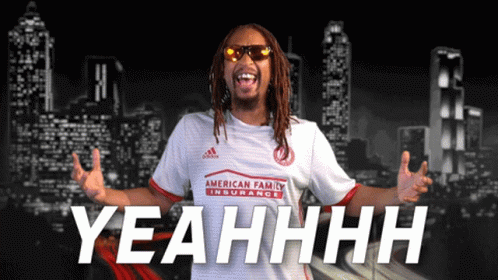 A Man Wearing A White Shirt That Says Yeahhhh GIF