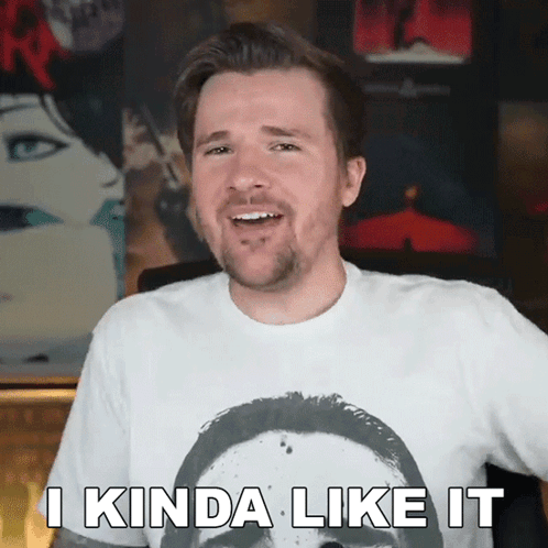 A Man Wearing A White Shirt With A Picture Of A Man On It Says " I Kinda Like It " GIF