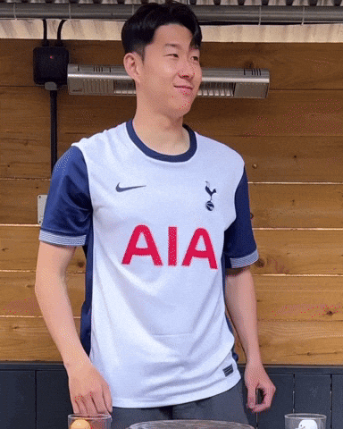 A Man Wearing A White Shirt With Aia Written On It GIF