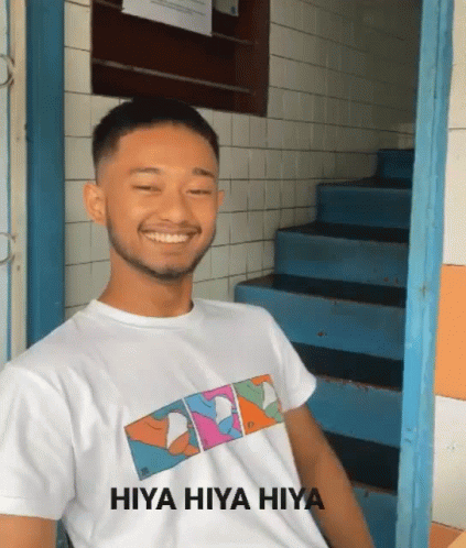 A Man Wearing A White Shirt With Hiya Hiya Hiya On It GIF