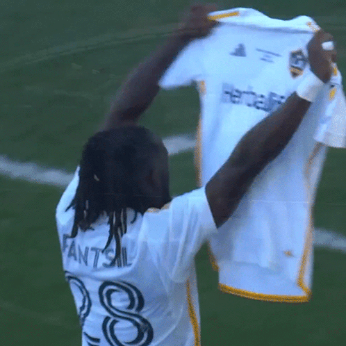 A Man Wearing A White Shirt With The Name Fantsil On The Back GIF