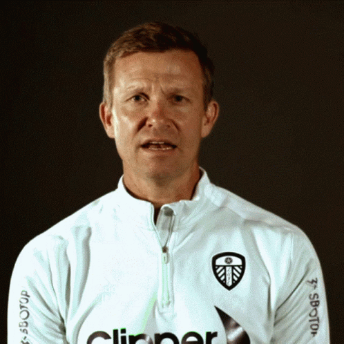 A Man Wearing A White Shirt With The Word Clipper On The Front GIF