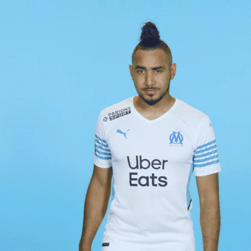 a man wearing a white shirt with uber on it