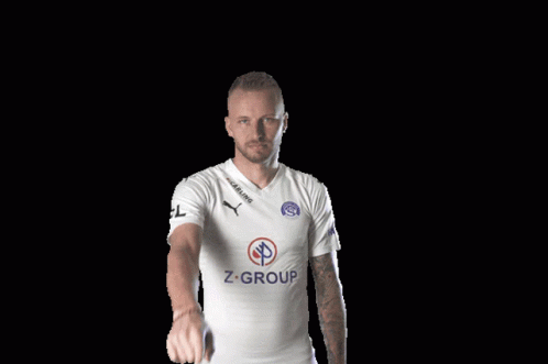 A Man Wearing A White Shirt With Z-Group On The Front GIF