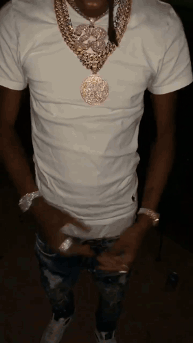 A Man Wearing A White T-Shirt And A Gold Necklace GIF