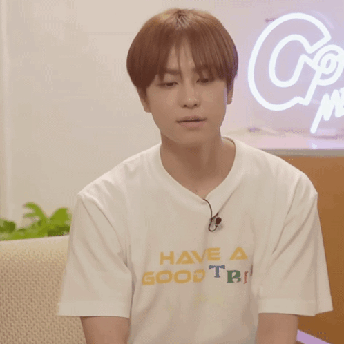 A Man Wearing A White T-Shirt That Says Have A Good Trip GIF