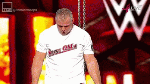 a man wearing a white t-shirt that says make love