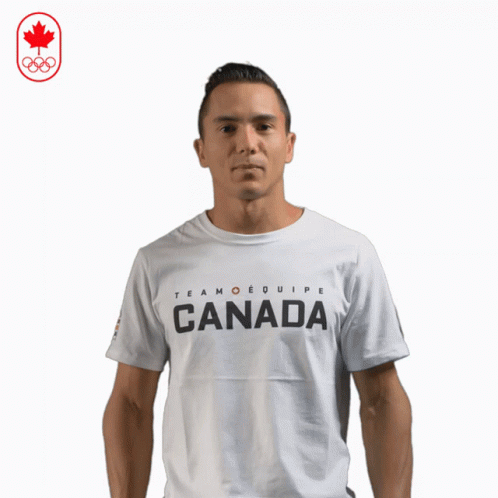 A Man Wearing A White T-Shirt That Says Team Equipe Canada GIF