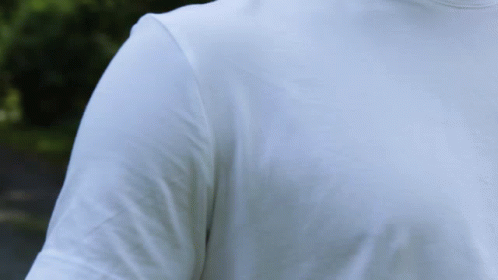 A Man Wearing A White T-Shirt With Long Sleeves And A Turtleneck GIF