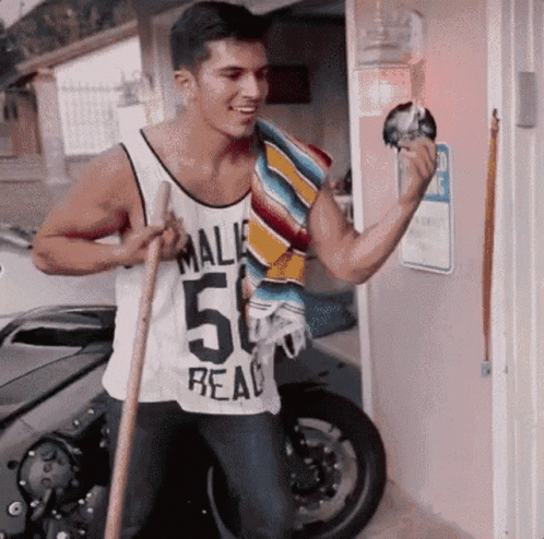 A Man Wearing A White Tank Top That Says Mali 50 Real GIF