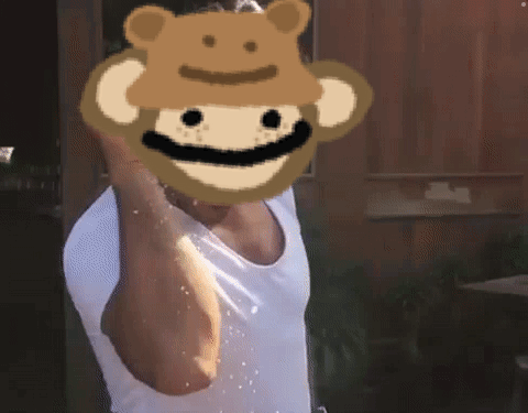 A Man Wearing A White Tank Top With A Monkey Face On His Face GIF