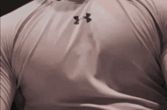 A Man Wearing A White Under Armour Shirt With Black Letters GIF
