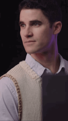 A Man Wearing A White Vest And A Blue Shirt GIF
