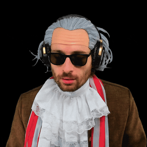 A Man Wearing A Wig And Headphones Has A White Lace Collar GIF