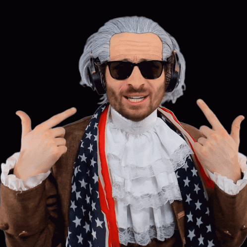 A Man Wearing A Wig And Headphones Is Pointing Up GIF