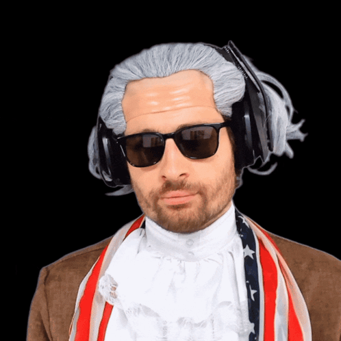 A Man Wearing A Wig And Sunglasses Has A Pair Of Headphones On His Head GIF
