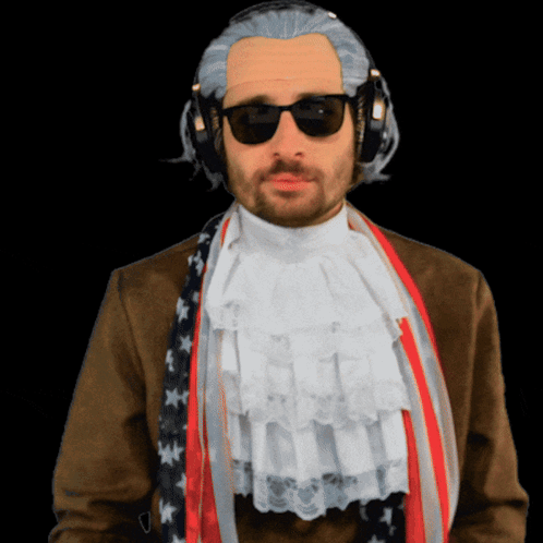A Man Wearing A Wig And Sunglasses Has A Scarf Around His Neck GIF