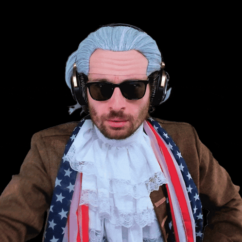 a man wearing a wig and sunglasses has headphones on