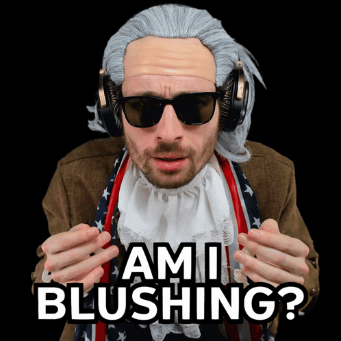 A Man Wearing A Wig And Sunglasses Has The Words Ami Blushing On His Face GIF
