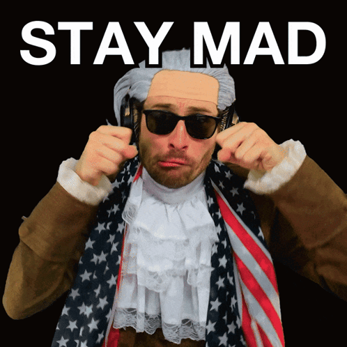 A Man Wearing A Wig And Sunglasses Has The Words Stay Mad Written Above Him GIF