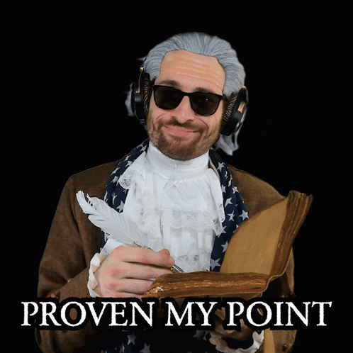 a man wearing a wig and sunglasses is holding a book and a feather in his hand with the words proven my point below him