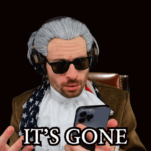 A Man Wearing A Wig And Sunglasses Is Holding A Cell Phone With The Words It 'S Gone Written On It GIF