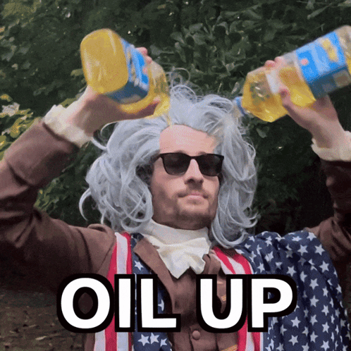 A Man Wearing A Wig And Sunglasses Is Pouring Oil Over His Head With The Words " Oil Up " Below Him GIF