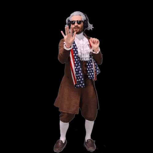A Man Wearing A Wig And Sunglasses Is Smiling GIF
