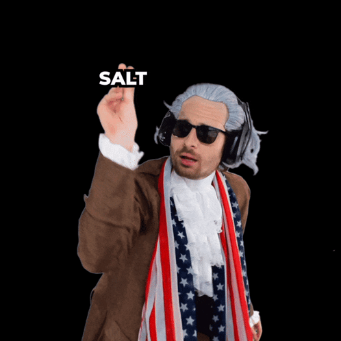 A Man Wearing A Wig And Sunglasses Pointing At The Camera With The Words Salt Behind Him GIF
