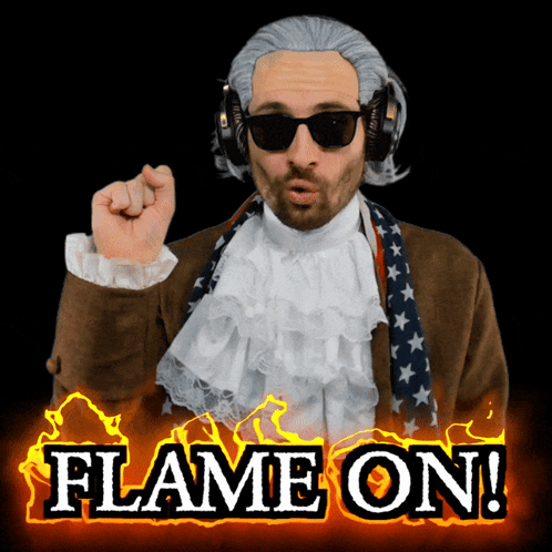A Man Wearing A Wig And Sunglasses With The Words Flame On Behind Him GIF