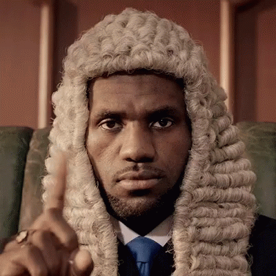 A Man Wearing A Wig And Tie Is Pointing GIF