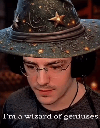 A Man Wearing A Wizard Hat And Glasses Says I 'M A Wizard Of Geniuses GIF
