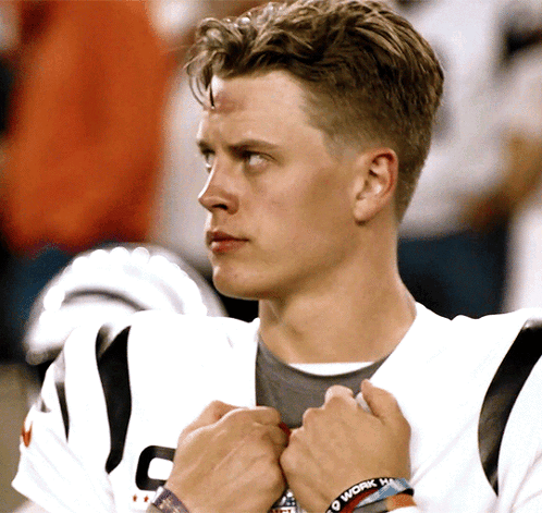 A Man Wearing A Wristband That Says " I Work Hard " GIF
