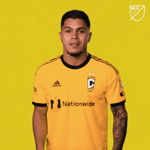 A Man Wearing A Yellow Adidas Jersey With The Word Vamos On The Bottom GIF
