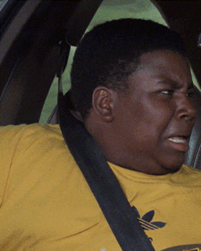 A Man Wearing A Yellow Adidas T-Shirt Is Sitting In A Car GIF