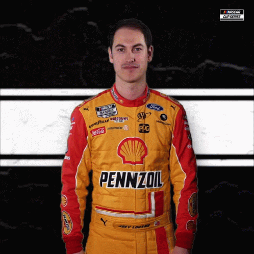 A Man Wearing A Yellow And Red Pennzoil Racing Suit GIF