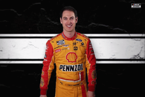 A Man Wearing A Yellow And Red Pennzoil Racing Suit GIF