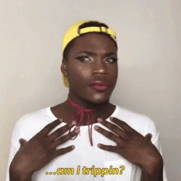 A Man Wearing A Yellow Hat And A White Shirt With The Words Am I Trippin Written On It GIF
