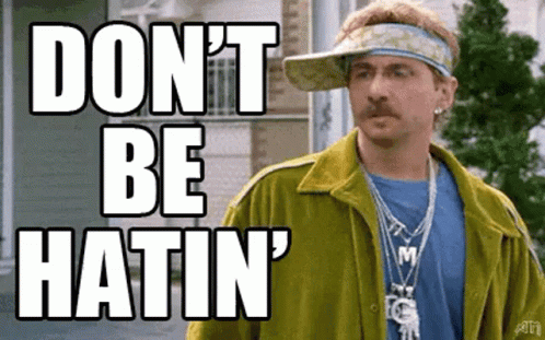 A Man Wearing A Yellow Jacket And A Hat With The Words `` Do N't Be Hatin '' Written On It . GIF