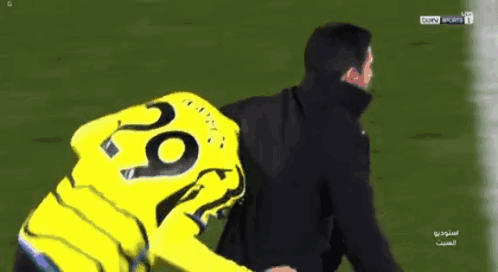 A Man Wearing A Yellow Jersey With The Number 28 On It GIF