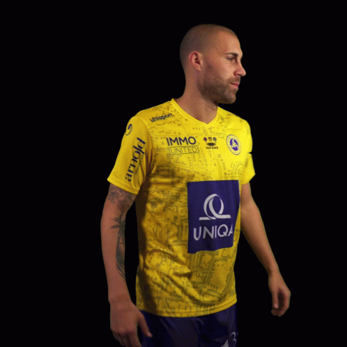 a man wearing a yellow jersey with the number 9 konrad on it
